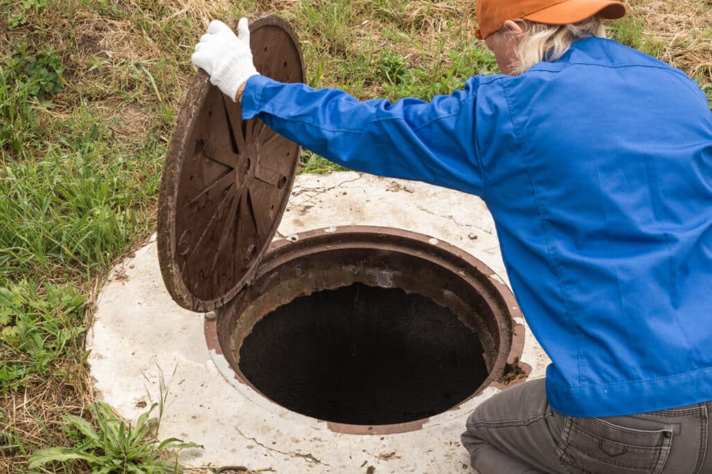 plumber maintaining a septic tanks